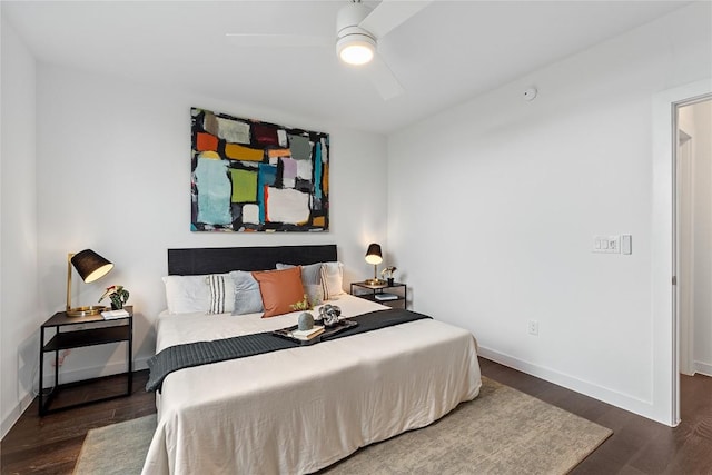 bedroom featuring wood finished floors, baseboards, and a ceiling fan