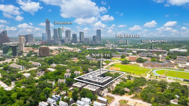 900 S 1st St S Unit 404, Austin, TX 78704 - aerial overview of property's location featuring property parcel outlined and city skyline