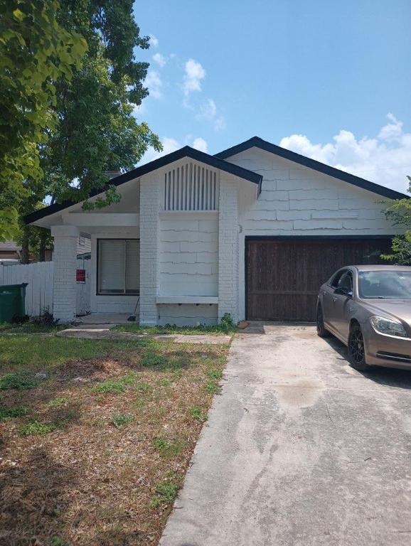 8730 Meadow Song, Converse, TX 78109 - single story home featuring concrete driveway, an attached garage, and brick siding