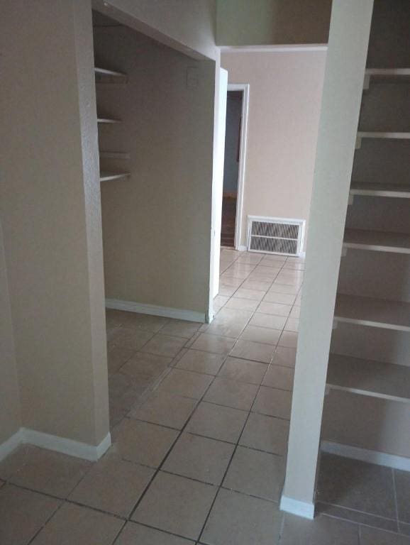 8730 Meadow Song, Converse, TX 78109 - hallway featuring tile patterned flooring and baseboards