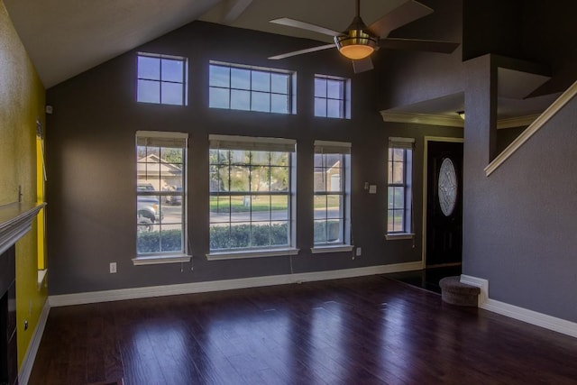unfurnished living room featuring baseboards, a ceiling fan, a healthy amount of sunlight, and wood finished floors