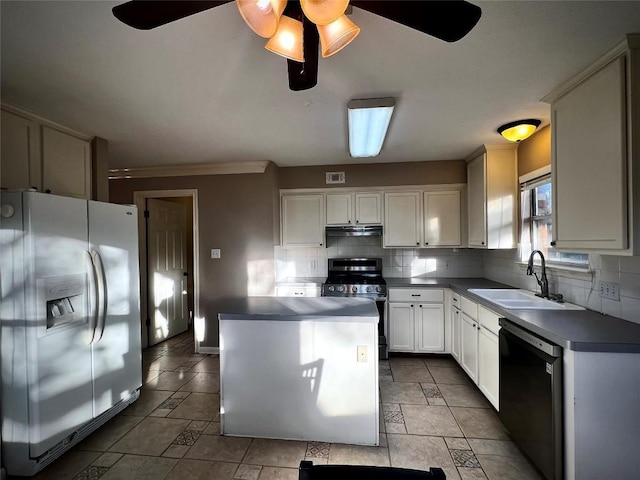 kitchen with a ceiling fan, tasteful backsplash, appliances with stainless steel finishes, and a sink