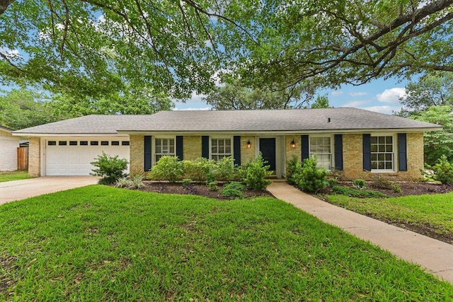 ranch-style house with concrete driveway, a garage, and a front lawn