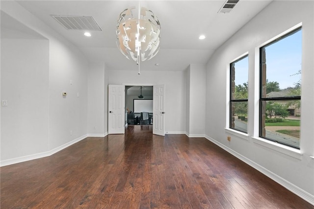 interior space featuring baseboards, recessed lighting, dark wood finished floors, and visible vents