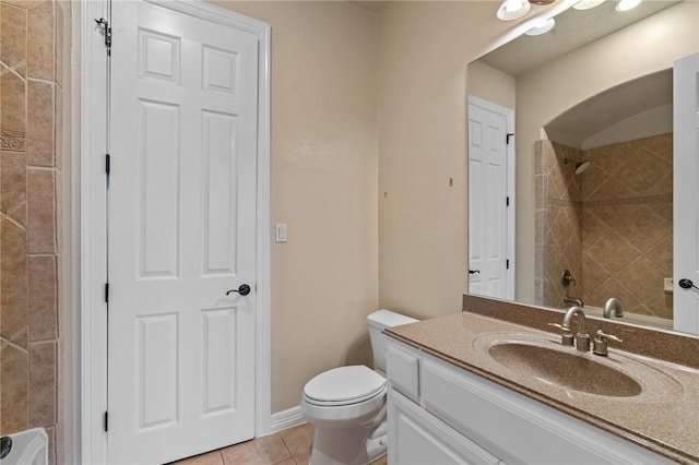 bathroom featuring toilet, tile patterned floors, and vanity