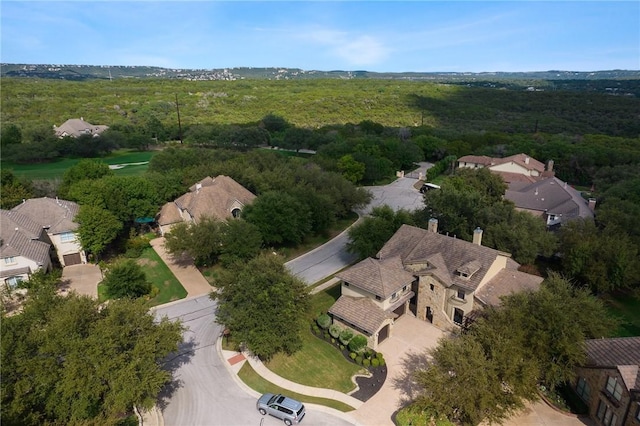 bird's eye view featuring a view of trees and a residential view