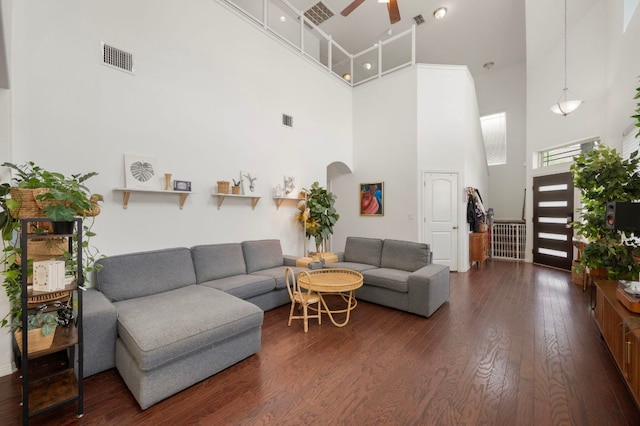800 Totis Rd, Austin, TX 78748 - living area featuring wood finished floors, a ceiling fan, visible vents, a towering ceiling, and arched walkways