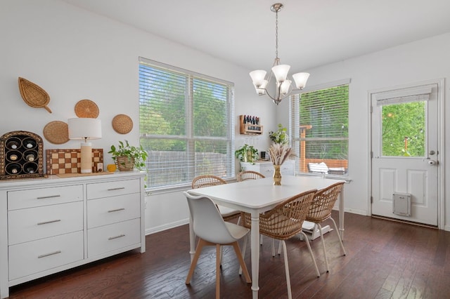 800 Totis Rd, Austin, TX 78748 - dining area featuring dark wood finished floors, a wealth of natural light, and a chandelier