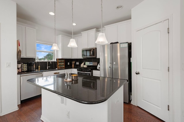 800 Totis Rd, Austin, TX 78748 - kitchen featuring white cabinetry, dark countertops, and appliances with stainless steel finishes