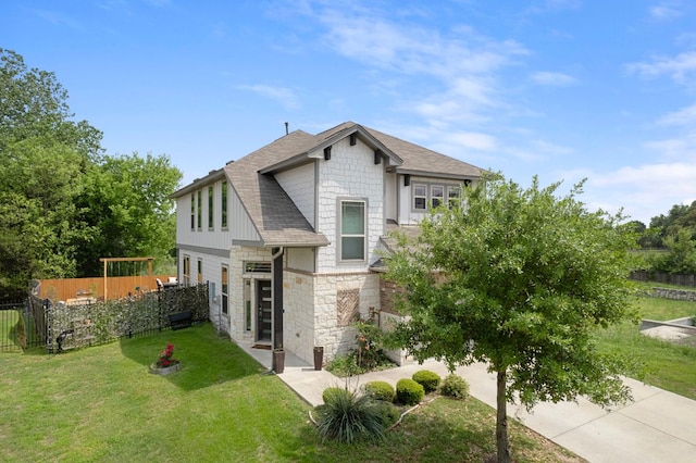 800 Totis Rd, Austin, TX 78748 - view of front of property with stone siding, roof with shingles, fence, and a front lawn