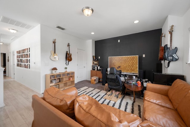800 Totis Rd, Austin, TX 78748 - living area with light wood-type flooring, recessed lighting, visible vents, and an accent wall