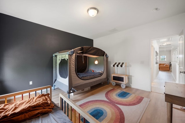 800 Totis Rd, Austin, TX 78748 - bedroom featuring attic access and wood finished floors