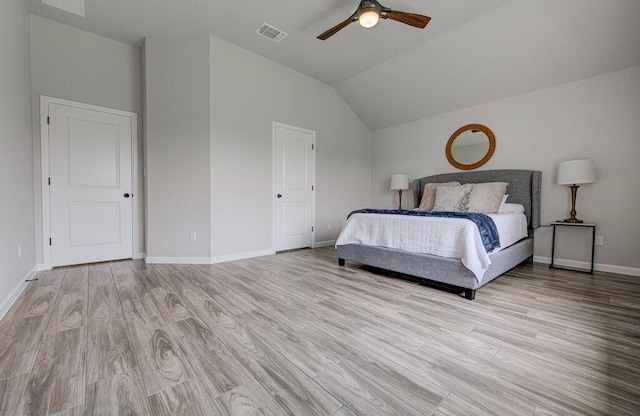 114 Joseph Hawkins Ln, Bastrop, TX 78602 - bedroom with vaulted ceiling, baseboards, light wood-type flooring, and ceiling fan