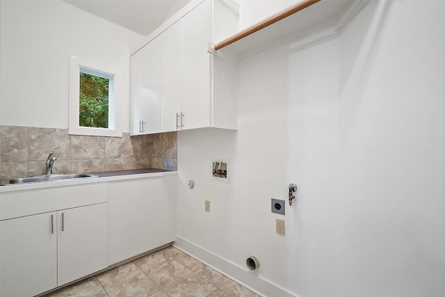 3007 Windsor Rd Unit B, Austin, TX 78703 - laundry area with electric dryer hookup, gas dryer hookup, cabinet space, hookup for a washing machine, and baseboards