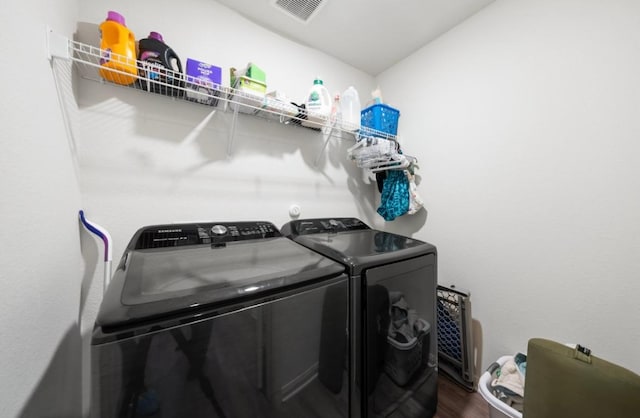 18720 Speculator Ln, Elgin, TX 78621 - washroom featuring laundry area, dark wood-type flooring, independent washer and dryer, and visible vents