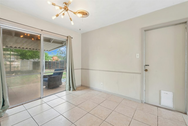 7000 Miranda Dr, Austin, TX 78752 - spare room featuring a chandelier and light tile patterned floors
