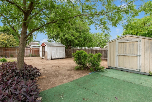 7000 Miranda Dr, Austin, TX 78752 - fenced backyard featuring a storage unit