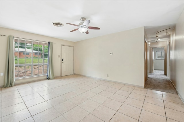 7000 Miranda Dr, Austin, TX 78752 - empty room with ceiling fan, light tile patterned floors, and rail lighting