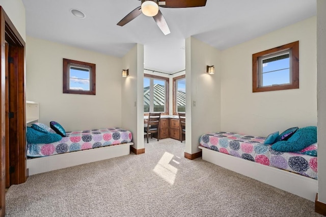 21216 Bertram Ln, Spicewood, TX 78669 - bedroom featuring carpet floors, baseboards, and ceiling fan
