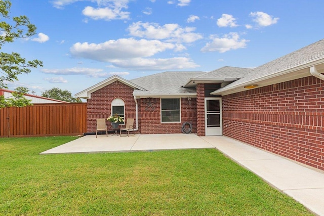 5315 Denmans Loop, Belton, TX 76513 - back of house featuring a patio, fence, a shingled roof, a yard, and brick siding