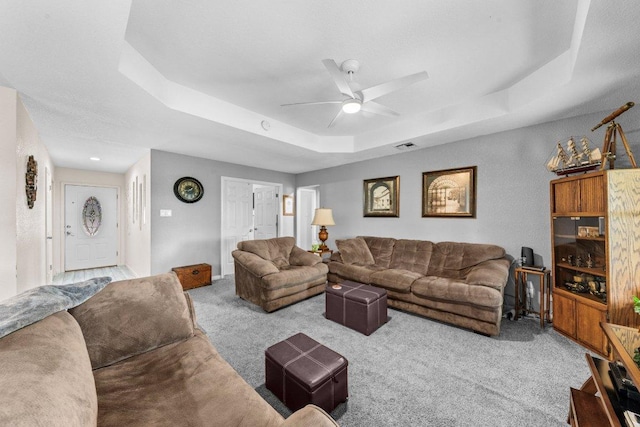 5315 Denmans Loop, Belton, TX 76513 - living room with a raised ceiling, visible vents, ceiling fan, and carpet