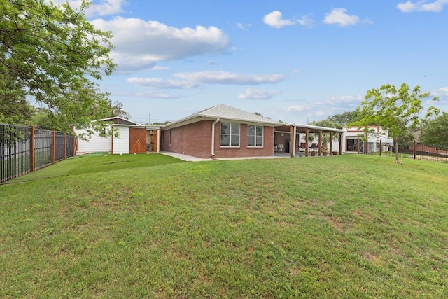 5315 Denmans Loop, Belton, TX 76513 - rear view of property featuring a lawn, a patio area, brick siding, and a fenced backyard