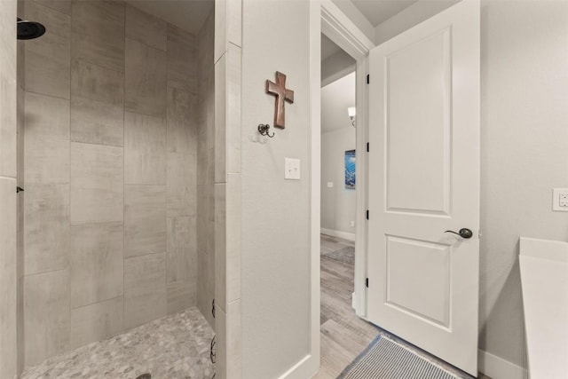 413 Creekside Dr, Salado, TX 76571 - bathroom featuring baseboards and tiled shower
