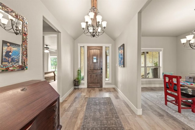 413 Creekside Dr, Salado, TX 76571 - foyer with vaulted ceiling, light wood-style flooring, a notable chandelier, and baseboards