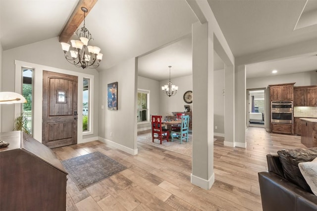 413 Creekside Dr, Salado, TX 76571 - entryway featuring an inviting chandelier, a wealth of natural light, baseboards, and light wood-style flooring