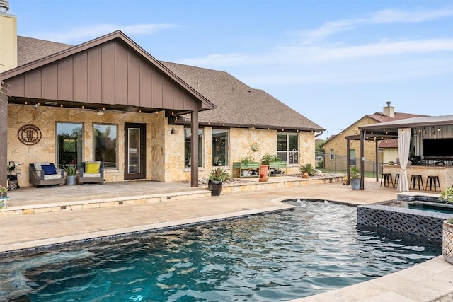 413 Creekside Dr, Salado, TX 76571 - back of house featuring stone siding, a patio, an in ground hot tub, outdoor dry bar, and an outdoor pool