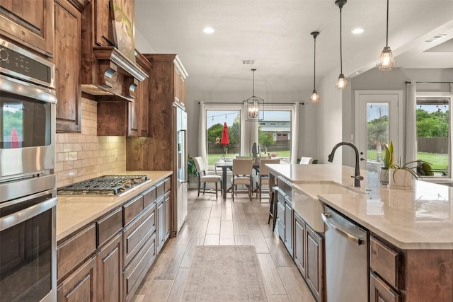 413 Creekside Dr, Salado, TX 76571 - kitchen featuring a sink, stainless steel appliances, decorative backsplash, a spacious island, and recessed lighting