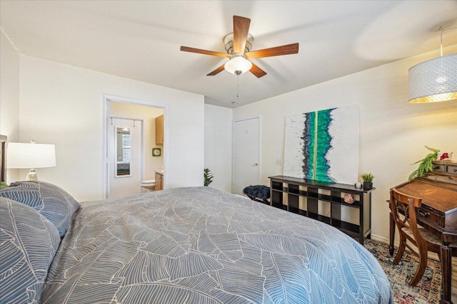 bedroom with a ceiling fan and ensuite bathroom
