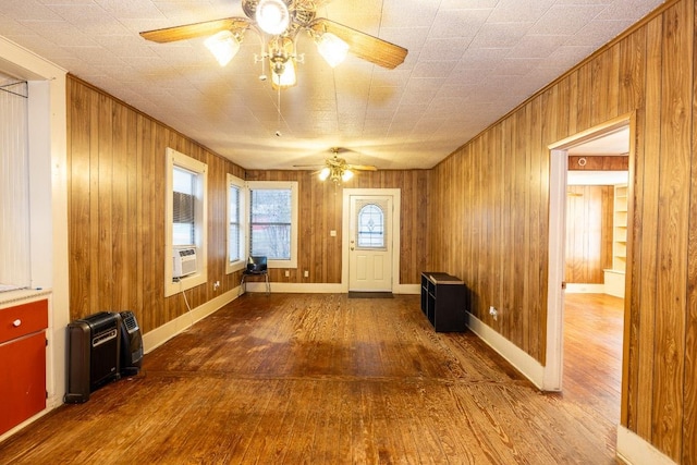 1226 Saint Matthew St, Gonzales, TX 78629 - foyer with wood walls, wood-type flooring, and ceiling fan