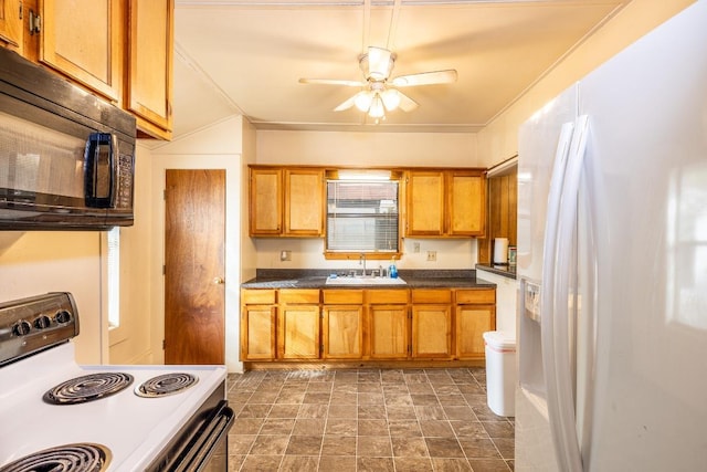 1226 Saint Matthew St, Gonzales, TX 78629 - kitchen with a sink, brown cabinetry, white refrigerator with ice dispenser, electric stove, and black microwave
