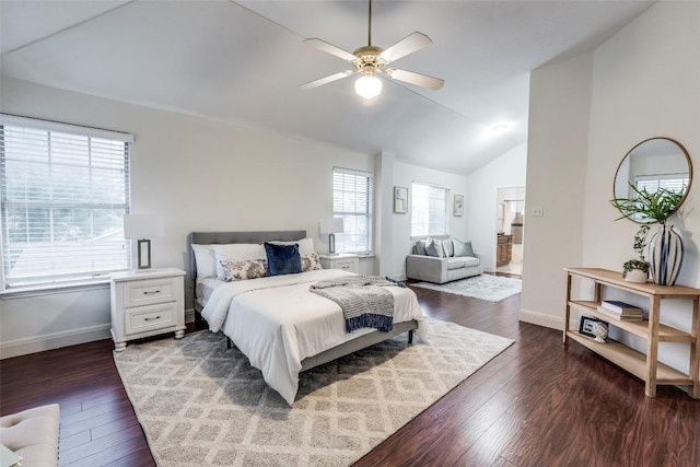 bedroom featuring dark wood-style flooring, lofted ceiling, baseboards, and multiple windows