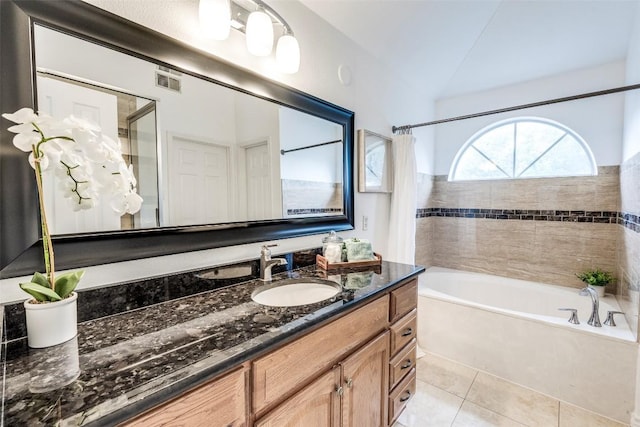 bathroom with shower / tub combo, visible vents, tile patterned flooring, vanity, and vaulted ceiling