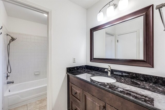 bathroom with vanity, shower / bathtub combination, and tile patterned floors