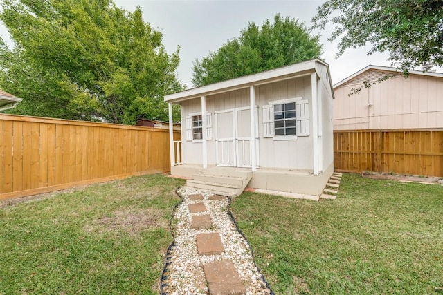 view of outbuilding with an outdoor structure and a fenced backyard