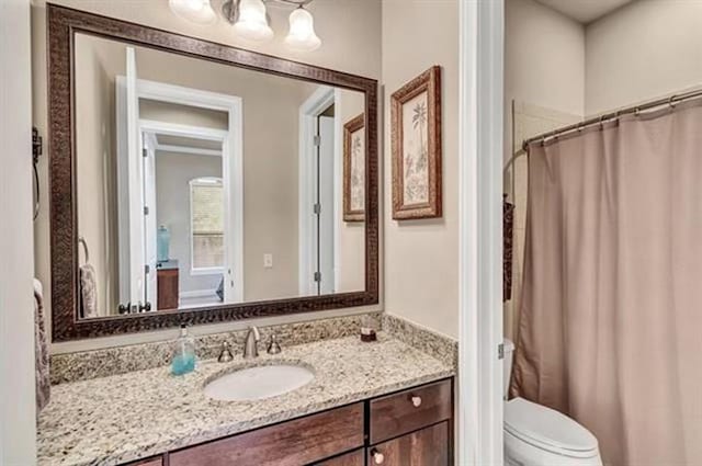 full bath with vanity and toilet