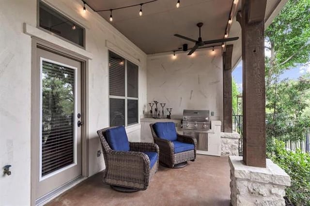 view of patio with area for grilling and ceiling fan