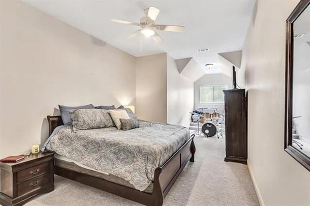 bedroom with light colored carpet, baseboards, and a ceiling fan