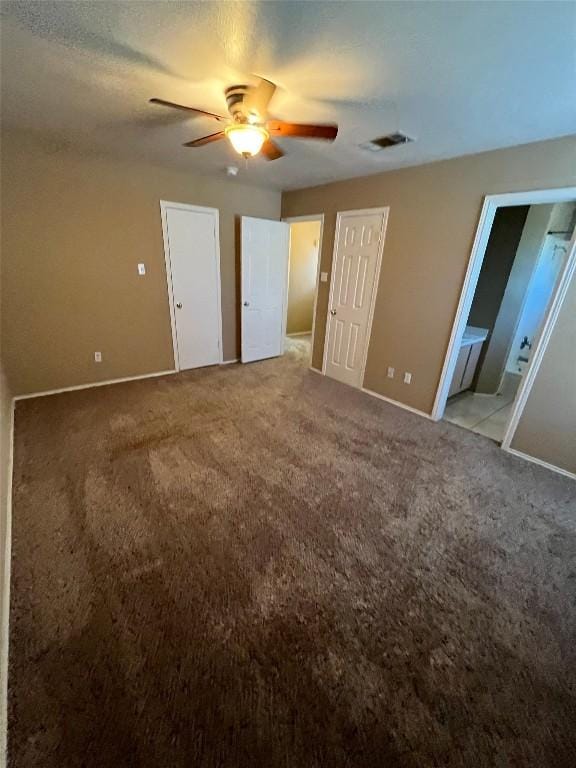 9625 Sugar Hill Dr, Austin, TX 78748 - unfurnished bedroom featuring ensuite bath, light carpet, baseboards, and a ceiling fan