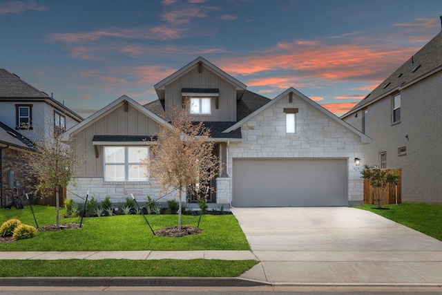 1108 Snowdrop Dr, Georgetown, TX 78628 - view of front facade with board and batten siding, stone siding, a lawn, driveway, and a shingled roof
