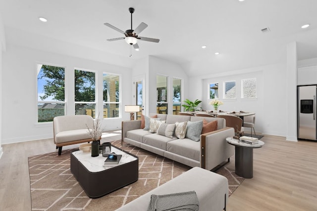 1108 Snowdrop Dr, Georgetown, TX 78628 - living room featuring light wood-style flooring, ceiling fan, recessed lighting, and lofted ceiling