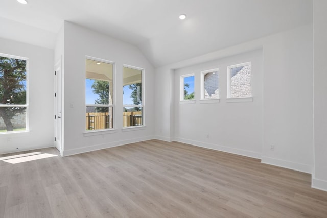 1108 Snowdrop Dr, Georgetown, TX 78628 - unfurnished room featuring plenty of natural light, light wood-style flooring, vaulted ceiling, and recessed lighting