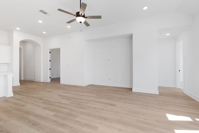 1108 Snowdrop Dr, Georgetown, TX 78628 - unfurnished living room with arched walkways, recessed lighting, a ceiling fan, and light wood finished floors