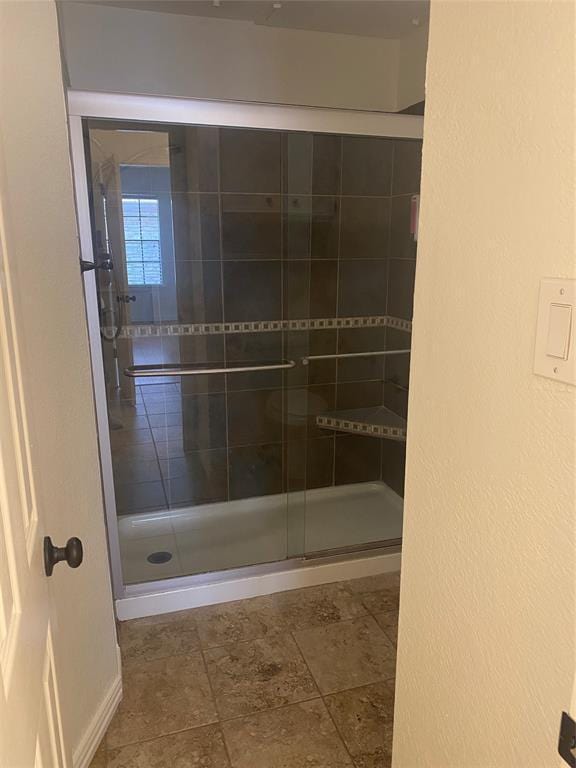 full bath with a shower stall
