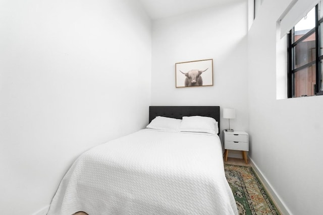 400 E 30th St Unit 200, Austin, TX 78705 - bedroom with baseboards and wood finished floors