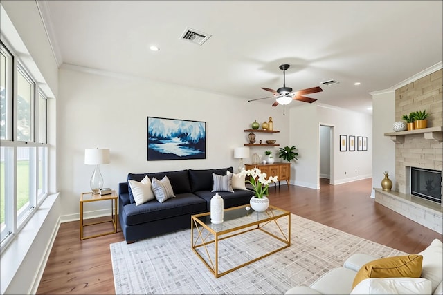 102 Ridgemont Ct, Georgetown, TX 78628 - living area with crown molding, wood finished floors, a ceiling fan, baseboards, and recessed lighting