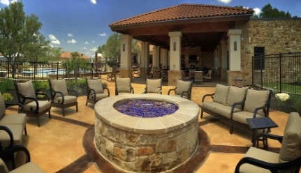 view of patio / terrace with an outdoor living space with a fire pit, a gazebo, and fence